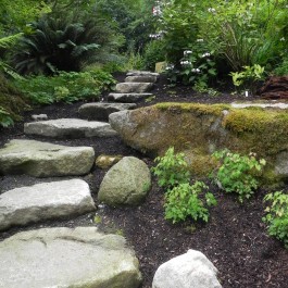 Natural stone steps and boulders represent the Earth element