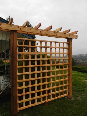 Wooden arbor with open lattice Sublime Garden Design